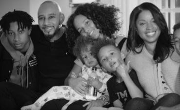 Young Erika with Alicia Keys, brother, and younger cousins